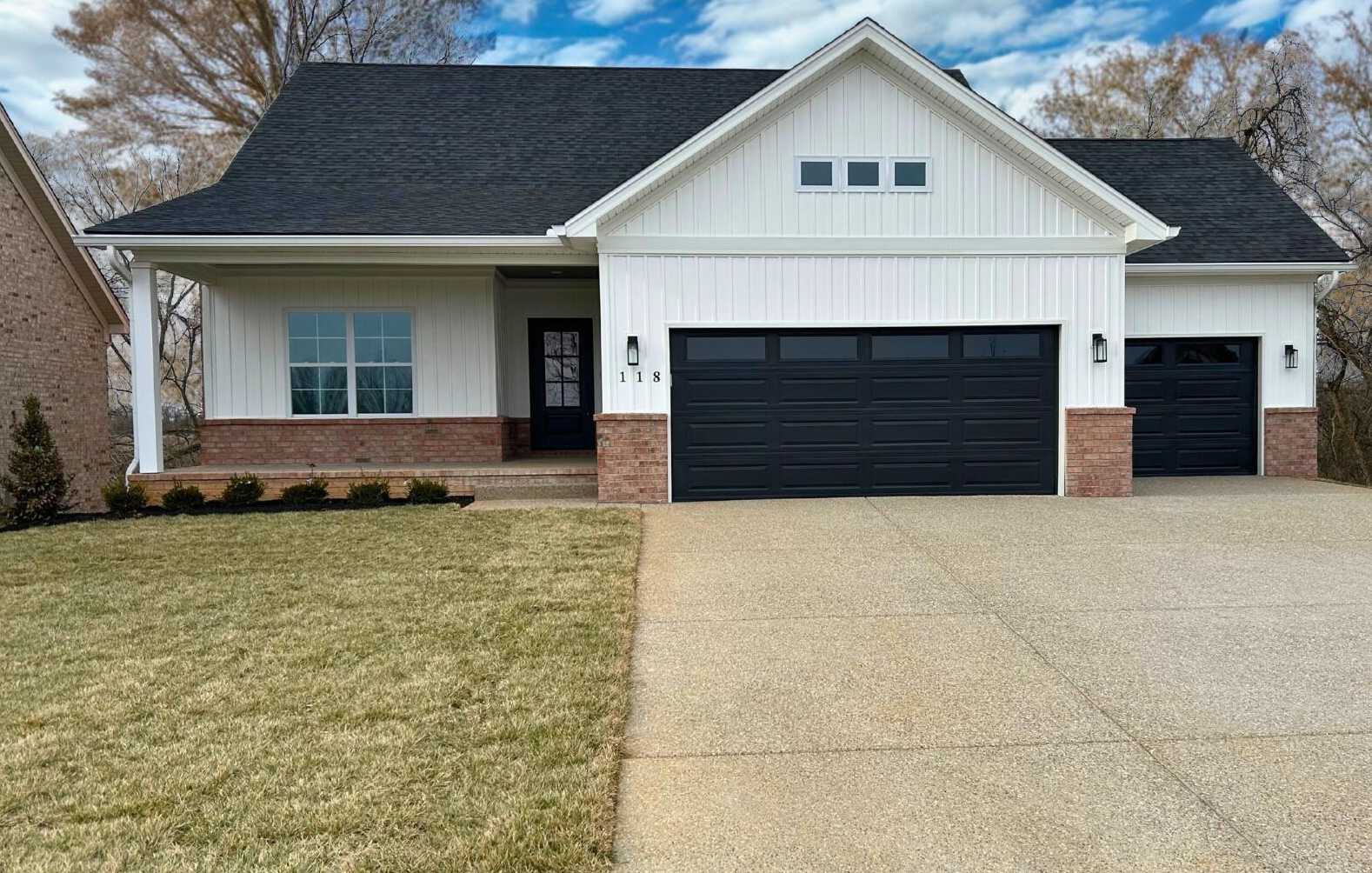 Modern farmhouse exterior with three-car garage