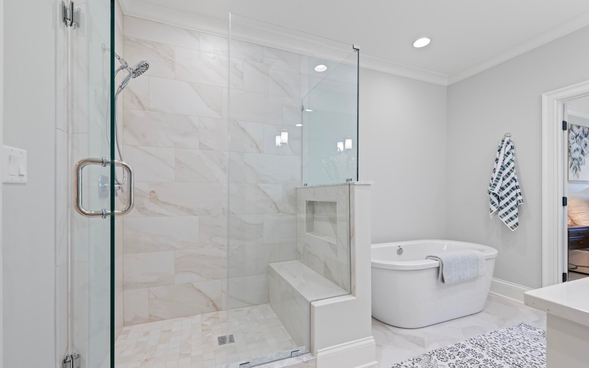 Walk-in marble shower with soaking tub